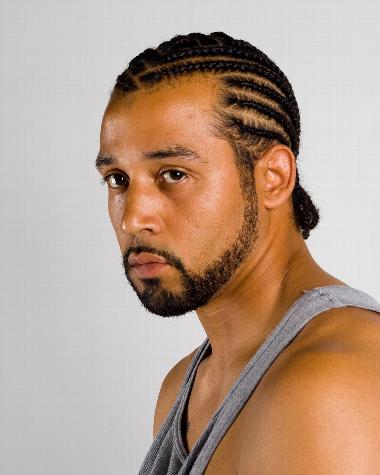Man with cornrows